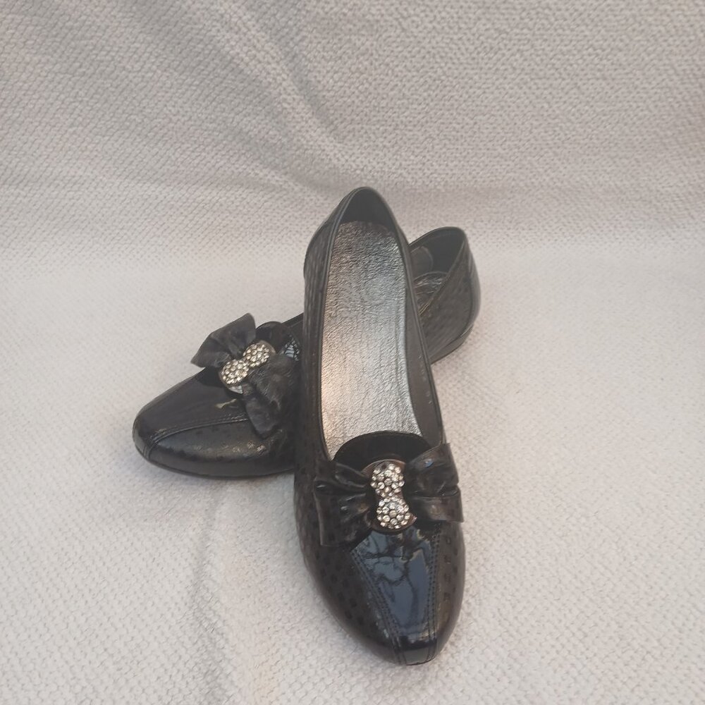 Black leather flats with diamond element